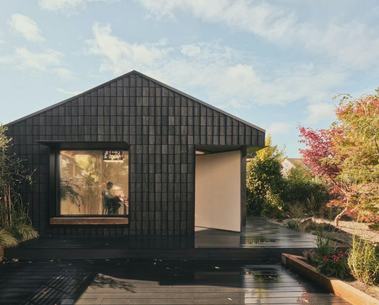 This Garden Studio Wrapped in Charred Timber Shingles Acts Like a Giant Bug Hotel
